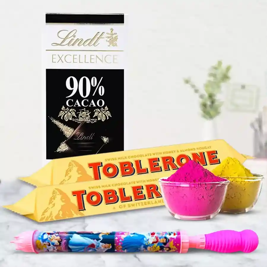 A festive bundle featuring Lindt chocolate bar, Toblerone bars, a long Pichkari, and vibrant herbal Gulal for Holi celebrations.