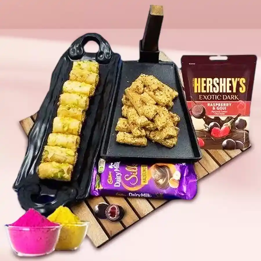 Exclusive Baklawa and Cadbury Chocolate gift combo for Holi celebration with Almond Biscotti, Dunkel Braun Roll Baklava, Dairy Milk Silk Hazelnut, Hershey’s Dark Raspberry N Goji, and Herbal Gulal in two packs