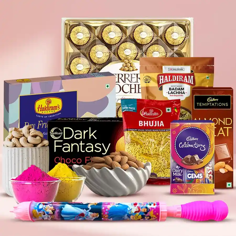 Vibrant Holi festival gift hamper with Gulal and Pitchkari, featuring Ferrero Rocher, assorted Cadbury chocolates, Haldirams snacks, and premium nuts, all beautifully packaged.