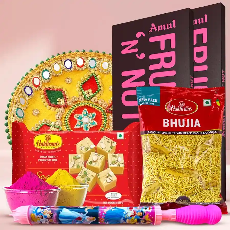 Expressive Holi Celebration Gift Hamper featuring Amul Fruit & Nut Bars, Designer Pooja Thali, Haldiram’s Soan Papdi and Bhujia, Herbal Gulal packs, and a colorful Pitchkari.