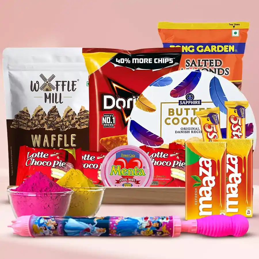 Holi gourmet treat hamper with dark chocolate waffle chips, cheesy Doritos, buttery cookies, salted almonds, Cadbury chocolates, Maaza drinks, mint, a long pitchkari, and herbal gulal arranged in a wooden tray.