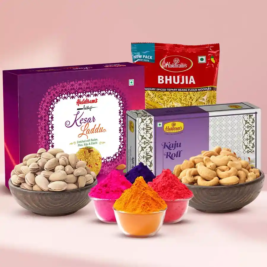 Ravishing Holi Sweets and Dry Fruits Hamper with Gulal packs, including Kesar Laddu, Kaju Roll, Pistachios, Cashews, and Bhujia, displayed in a festive arrangement.