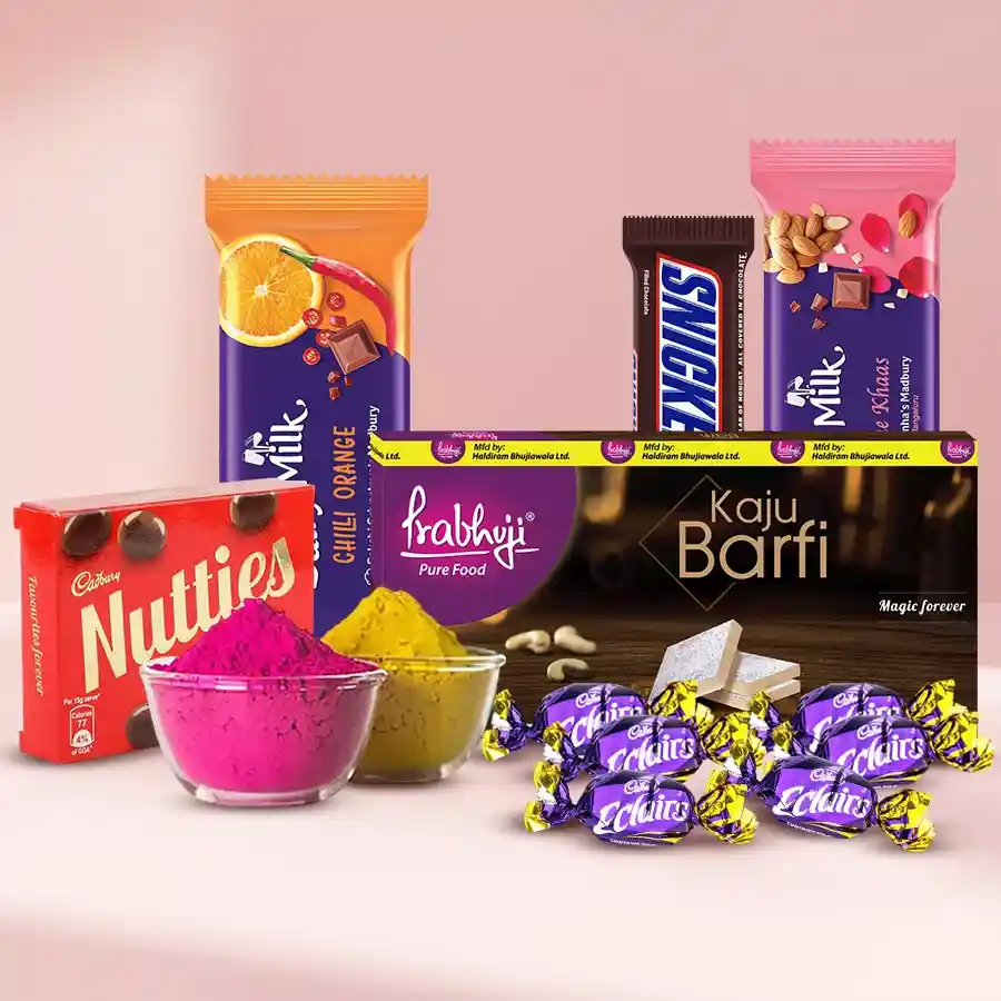 Colorful assortment of Holi sweets and chocolates with herbal gulal in a festive arrangement