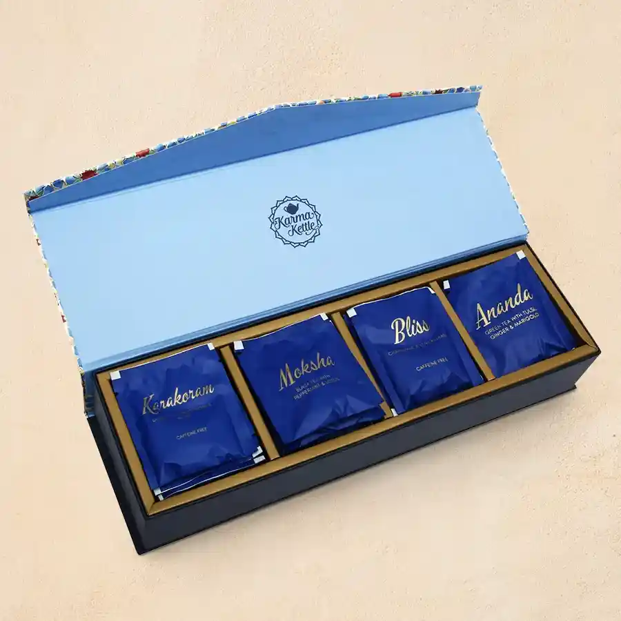 Think Positive Tea Gift Set featuring four silken pyramid teabags in a beautifully arranged hamper.