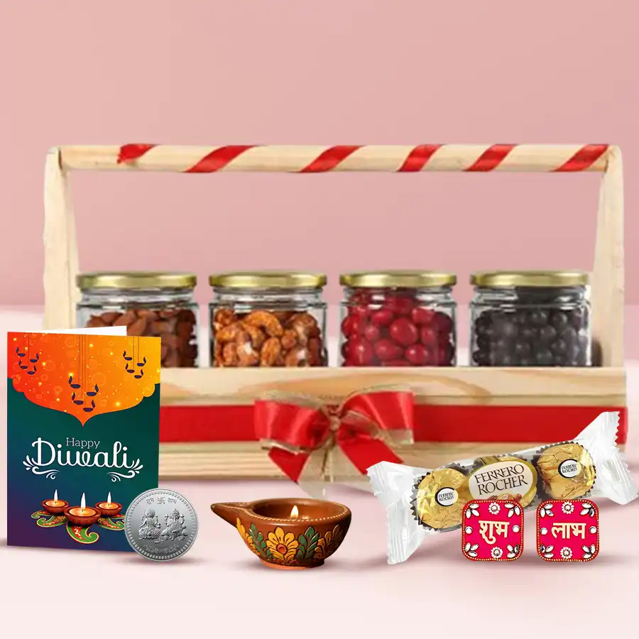Diwali Special Nutties N Diya Hamper featuring a wooden basket with dried fruits, Ferrero Rocher chocolates, a decorative diya, Shubh Labh wall stickers, a silver-plated coin, and a Diwali wishing card.
