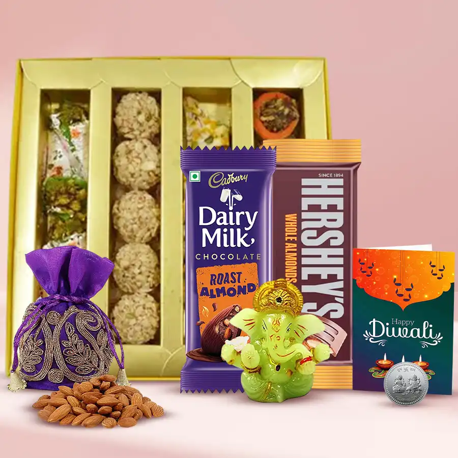 All About Festive Wishes Gift Hamper featuring sweets, chocolates, silver plated coin, Ganesh idol, almond potli, and Diwali card.