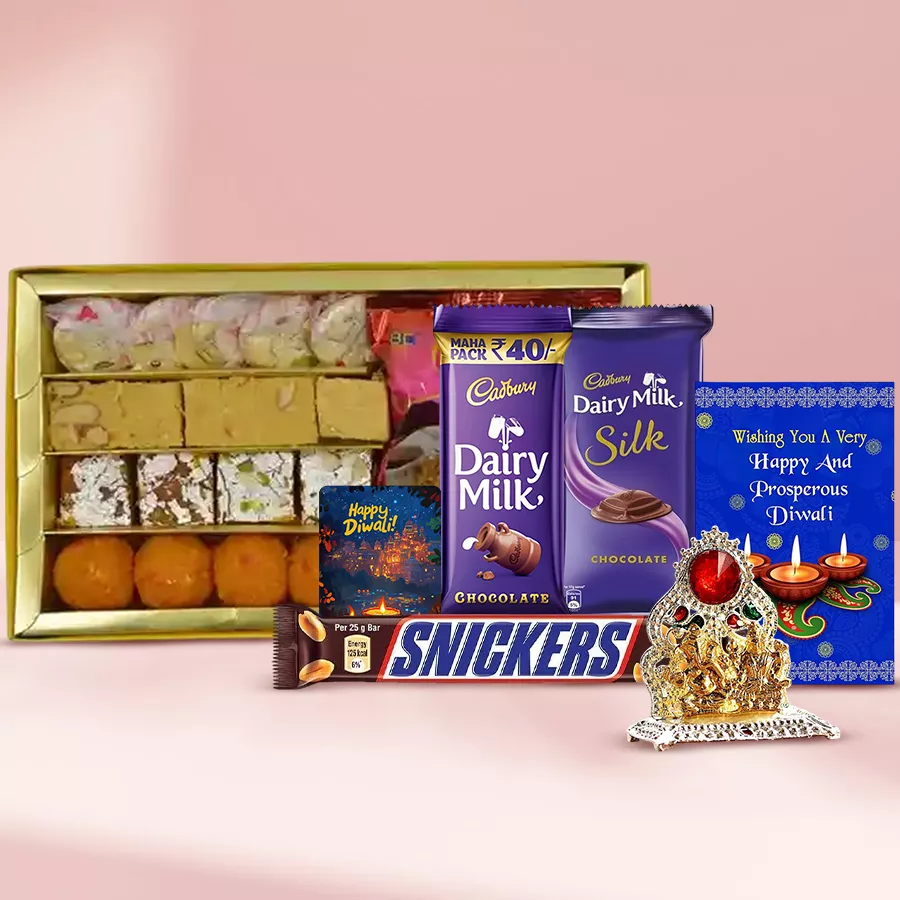 Diwali gift hamper featuring traditional sweets, snacks, chocolates, a Ganesh Laxmi Mandap, a handcrafted fridge magnet, and a festive card