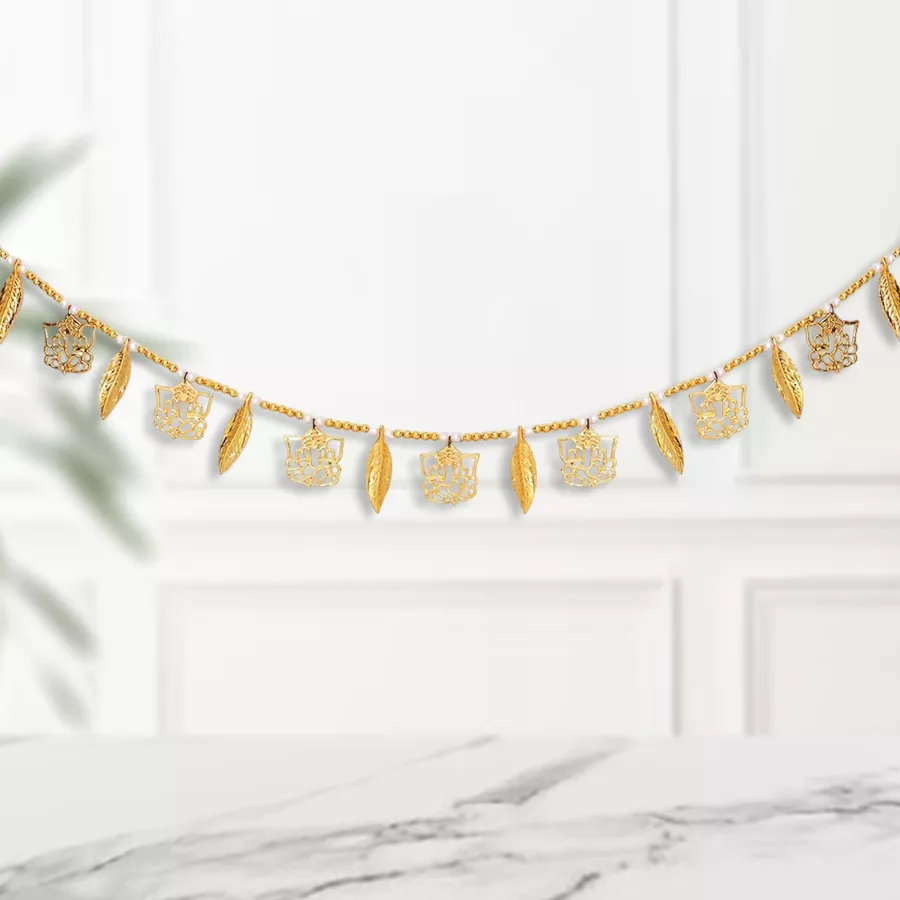 Ganesha on Leaves Decorative Door Toran in gold metal, featuring Lord Ganesha and intricate leaf designs, measuring 35” x 5”.