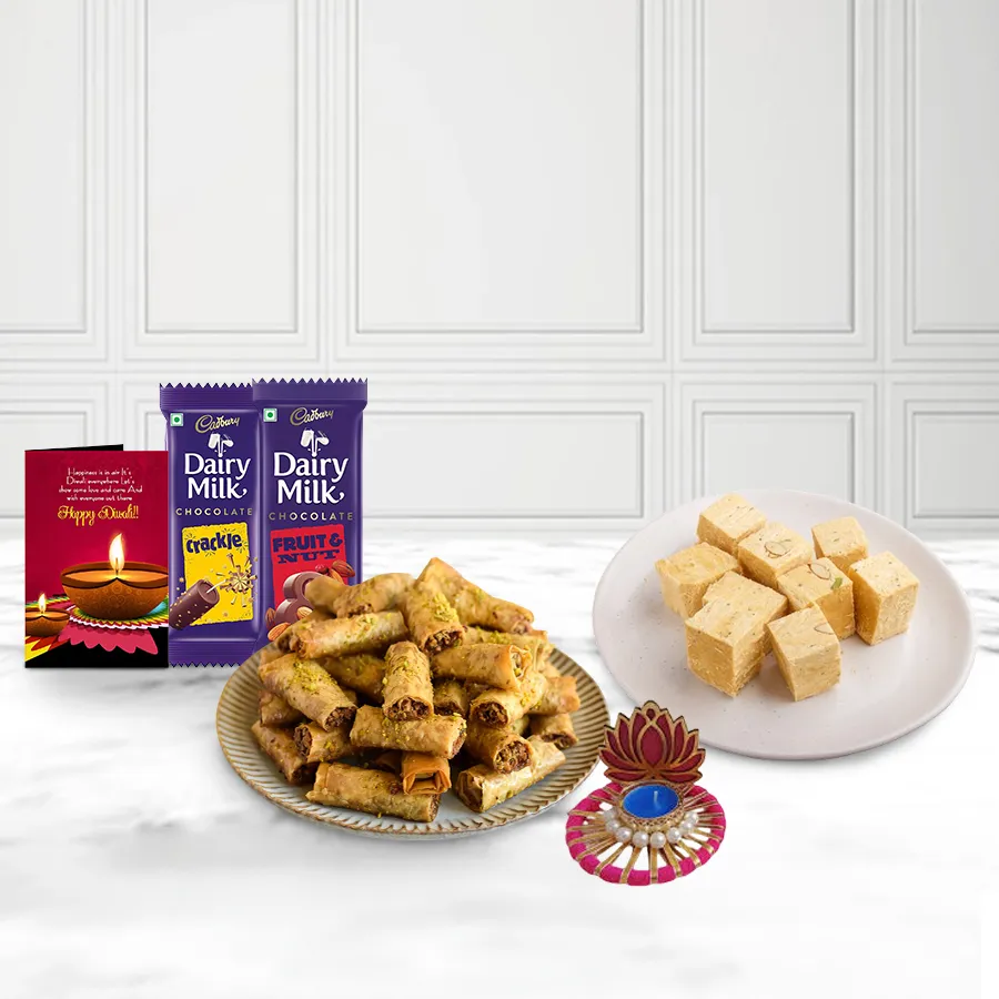Savory Roll Baklava gift basket with Soan Papdi, Cadbury chocolates, Lotus Tea Light Candle Holder, and a Diwali card