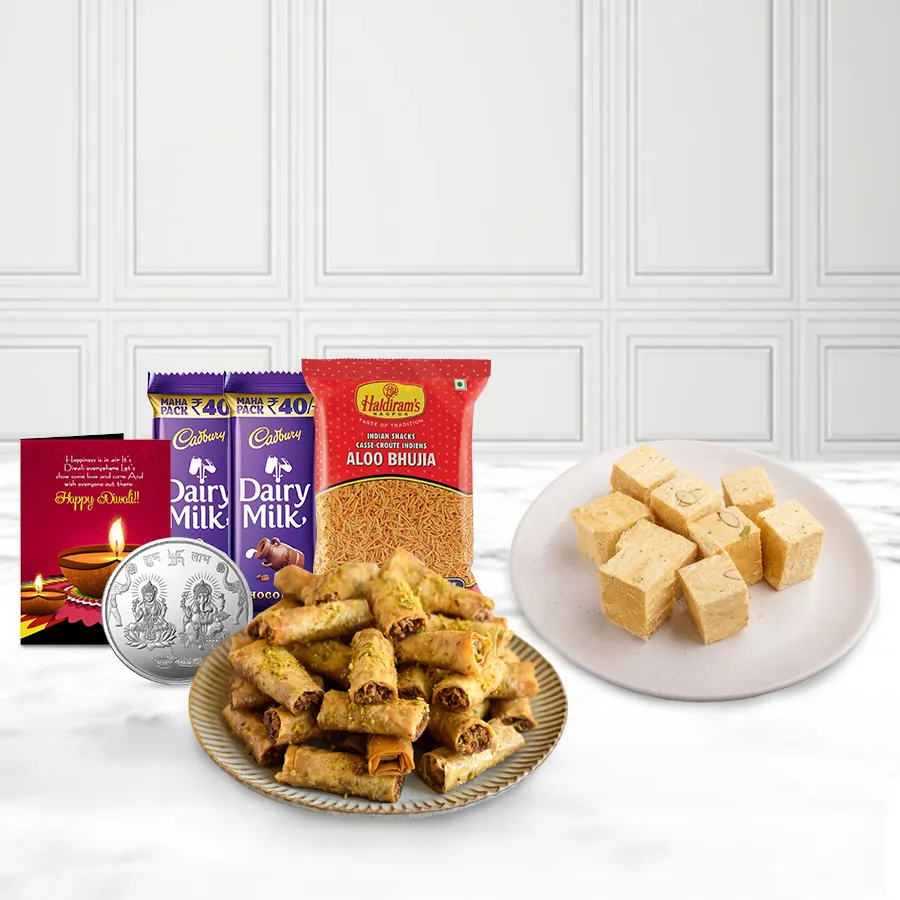 Endearing Roll Baklava Pack N Sweetness Soan Basket with Roll Baklava, Soan Papdi, Bhujiya, Cadbury Dairy Milk, Ganesh-Laxmi coin, and Diwali card