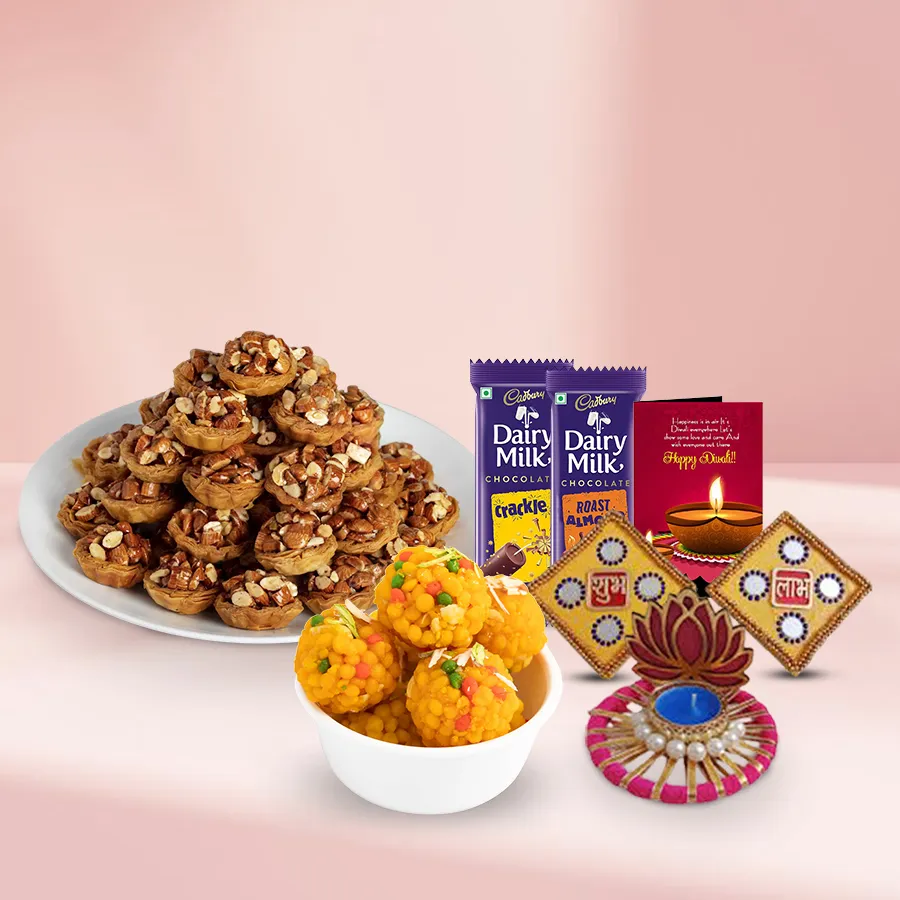 Heavenly Tart Baklava and Boondi Treat gift basket with Tart Baklava, Boondi Laddoos, Cadbury chocolate bars, Lotus tea light holder, Shubh Labh wall sticker, and Diwali card