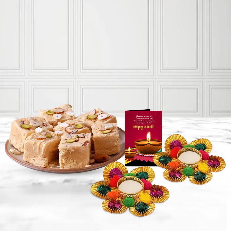 Festive hamper with two Pom-Pom Diyas, a 200g box of Soan Papdi, and a Diwali wishing card