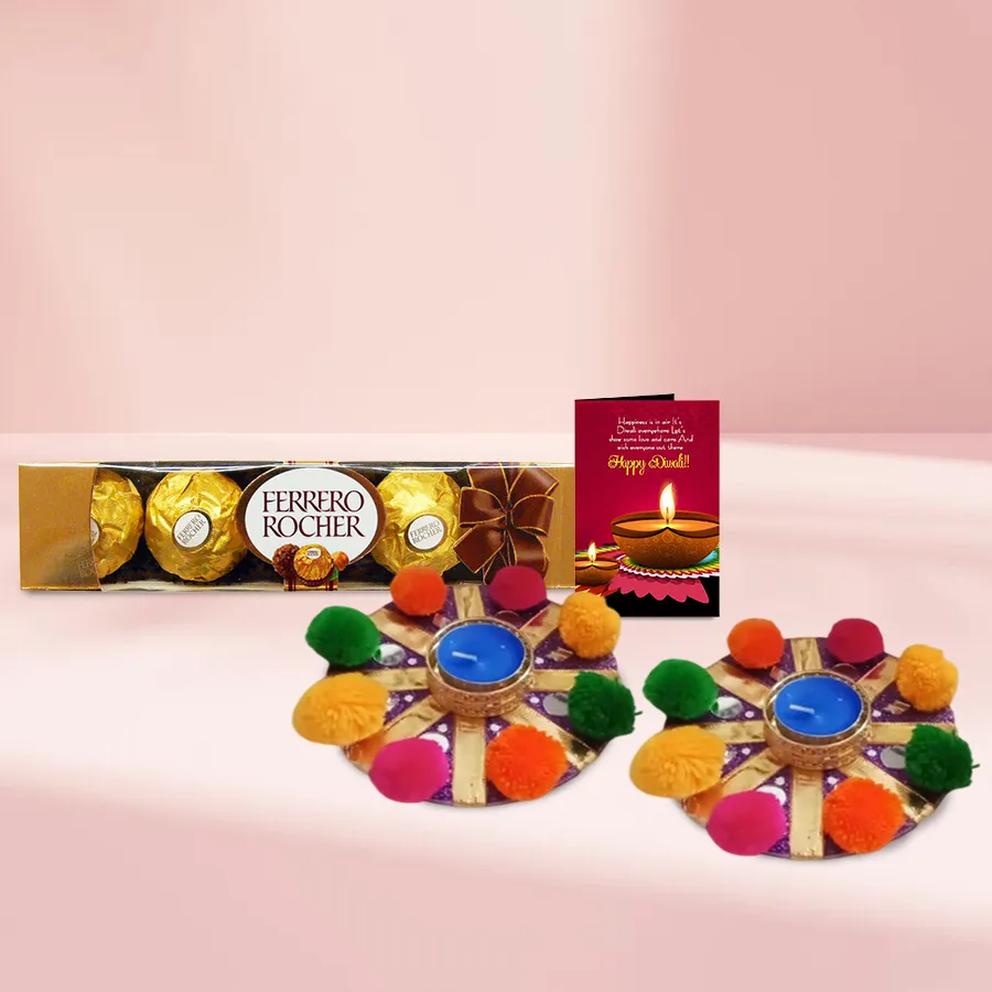 Joyous Vibes Diwali Gift Combo featuring a 2-piece Fancy Pompom Diya Set, a 4-piece Ferrero Rocher Chocolate Pack, and a Diwali Wishing Card.