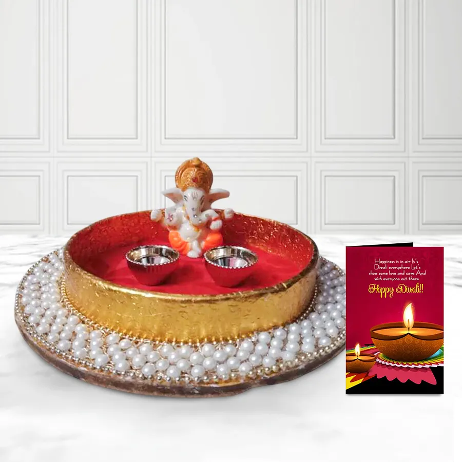 Pearl design Puja thali with a Ganesh idol, accompanied by a Diwali wishing card.
