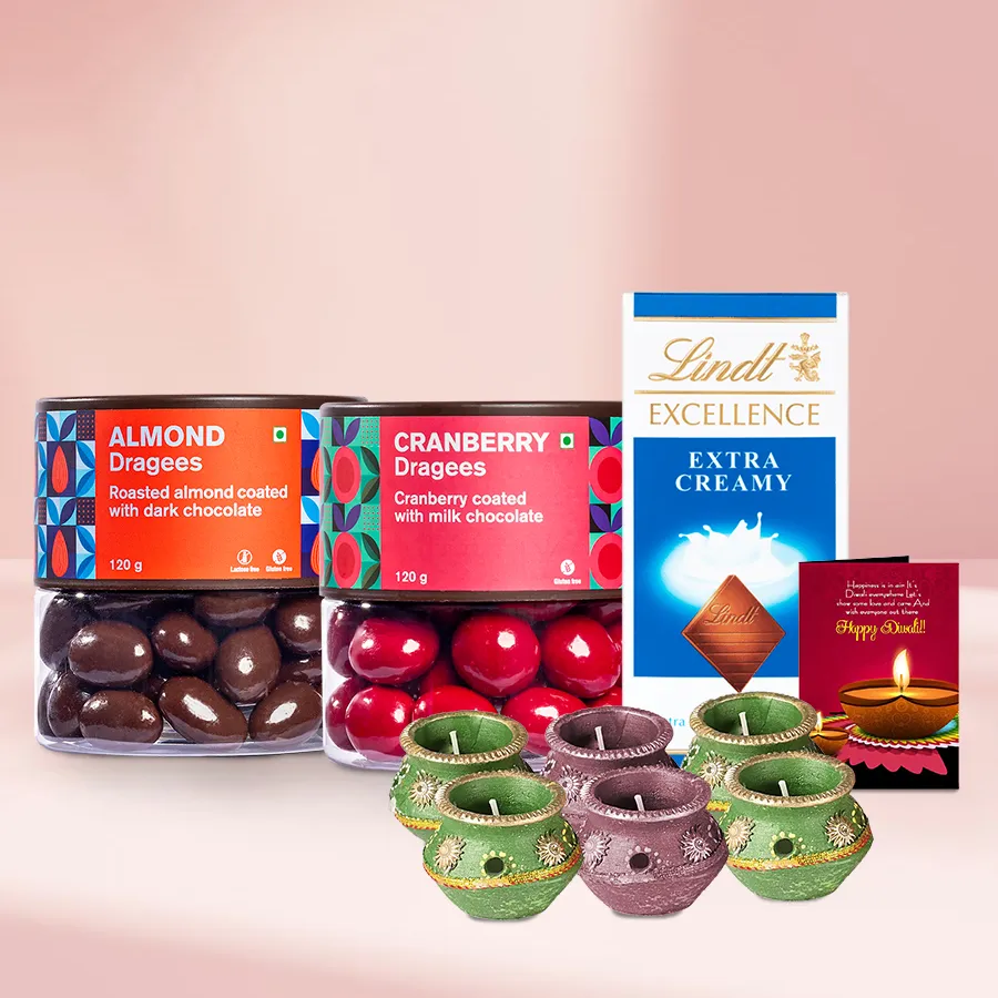 Winsome Almond and Cranberry Dragee Gift Basket with Lindt chocolates, Diwali decorations, and a heartfelt card