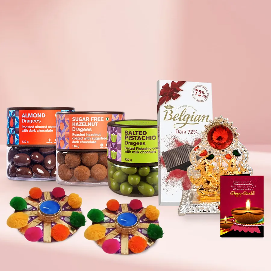 Belgian chocolate gift basket featuring chocolate bars, almond and pistachio dragees, sugar-free hazelnuts, decorative pom pom diyas, Ganesh-Laxmi Mandap, and a personalized Diwali card.