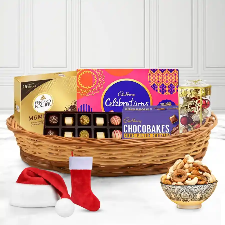Assorted chocolates and festive decorations in a reusable cane basket for Christmas