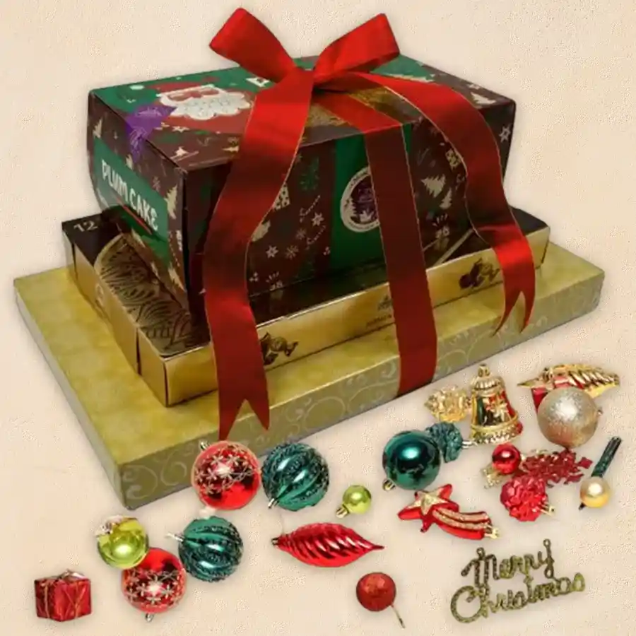 Chocolicious 3 Tier Gift Tower decorated with Xmas accents featuring fruit cake, Ferrero Rocher Moments, decadent truffle chocolates, and a box of free Xmas decorations.