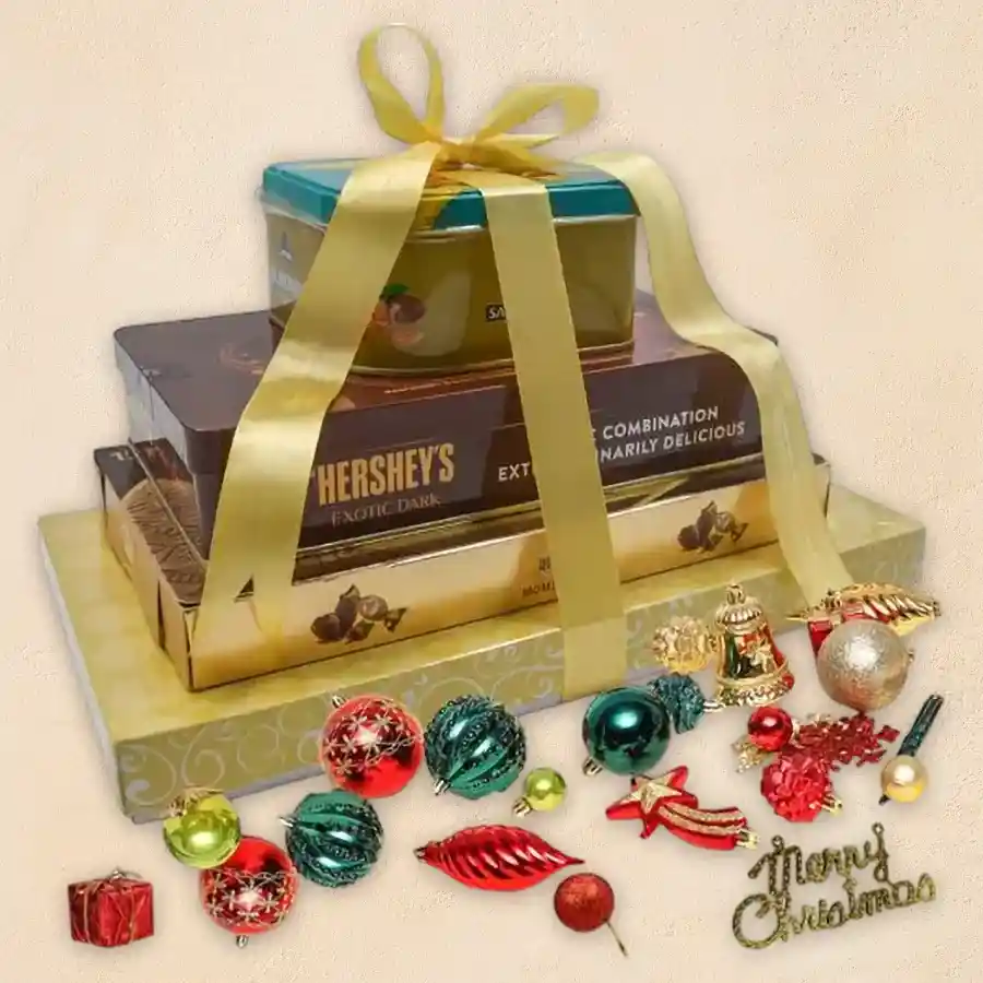 Toothsome 6 Steps Chocolate Tower with assorted chocolates and festive Christmas decorations