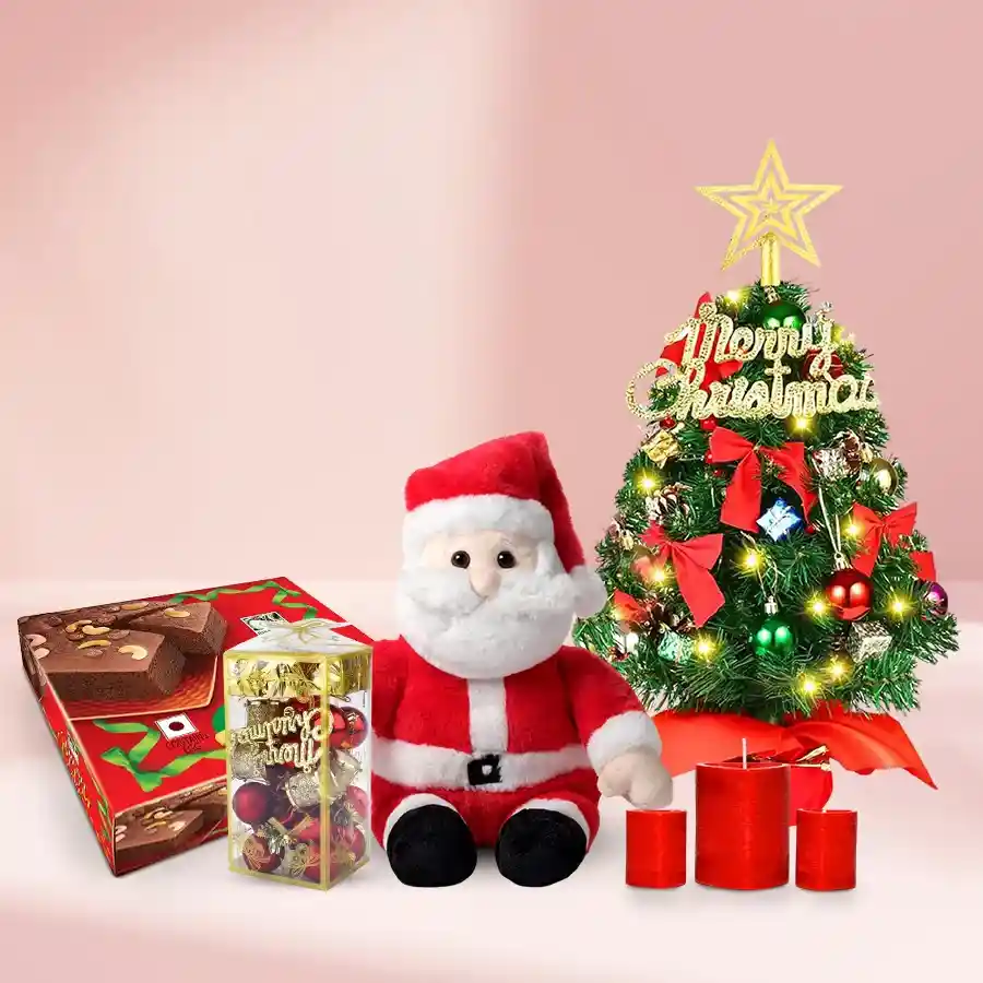 Treasure Treat Christmas Hamper featuring a Santa soft toy, Bisk Farm Plum Cake, two Christmas candles, a 1-ft Christmas tree, and festive decorations.