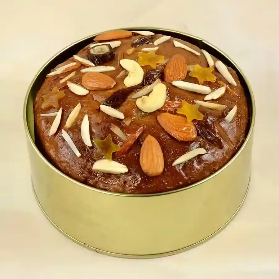 Fresh-Baked Dry Fruit Cake with a golden crust and colorful dried fruits, beautifully presented on a wooden table