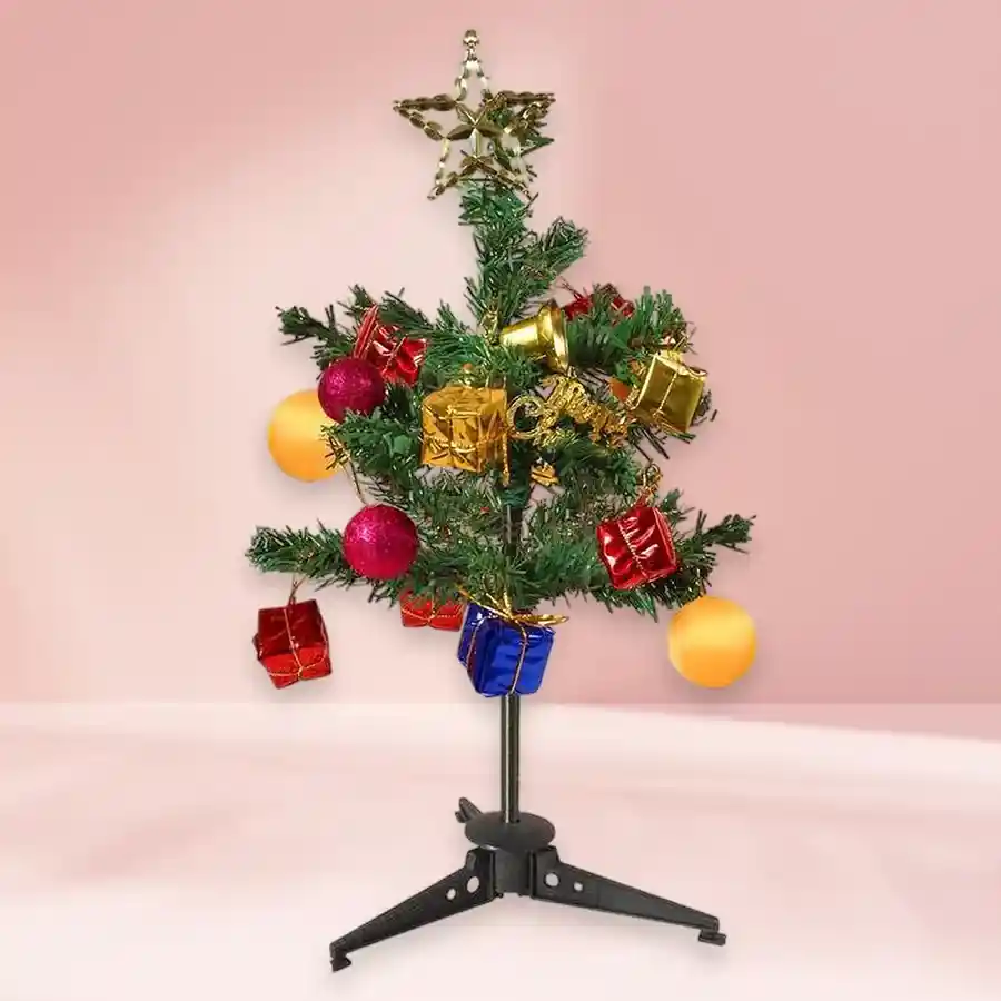 Miniature Christmas tree gift set with decorations and a Merry Christmas tag