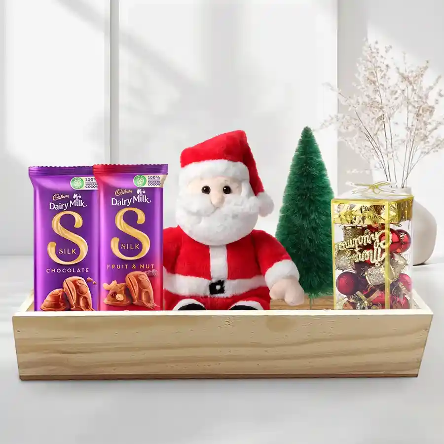 Yummy Cadbury Chocolates with Santa Claus and Christmas decorations in a reusable wooden gift box