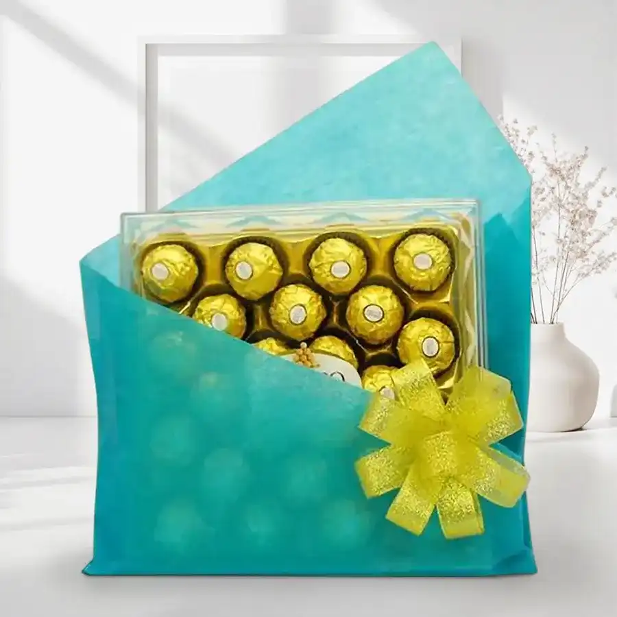 Ferrero Frenzy box with 24 Ferrero Rocher chocolates wrapped in festive blue tissue, suitable for Christmas gifting and sharing.