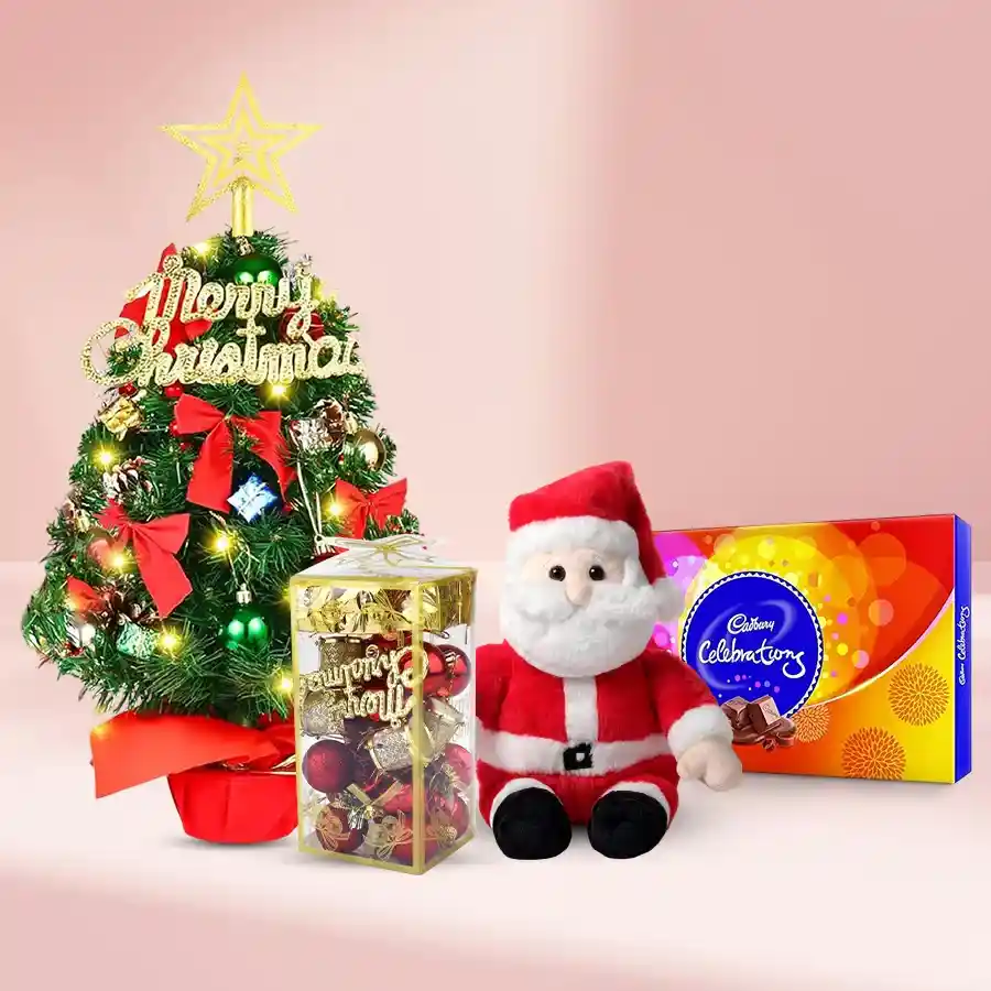 Christmas Celebration Hamper featuring a 1-ft Christmas tree, sparkling bells, decorations, Santa figure, and Cadbury’s Celebration goodies.