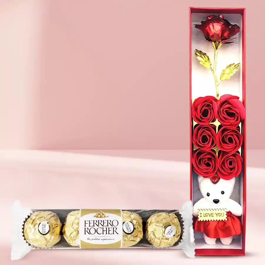 Attractive Rose Day gift set featuring artificial red rose, cuddly teddy bear, scented perfume, and Ferrero Rocher chocolates