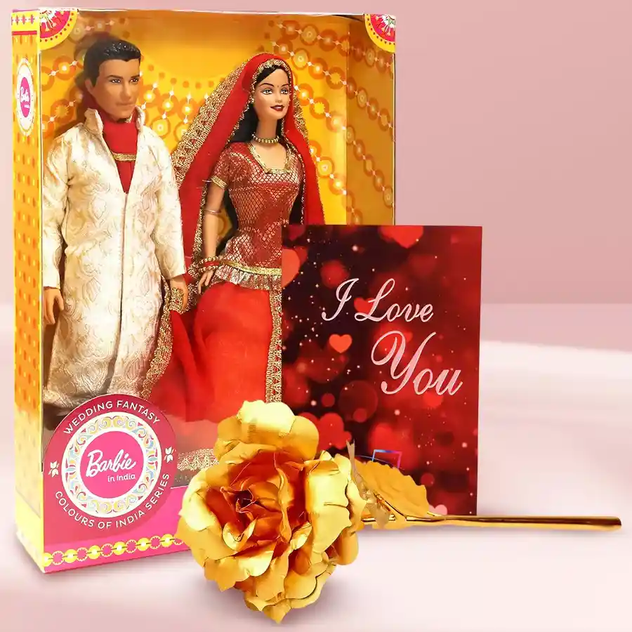 Gift set featuring an artificial golden rose, Indian-inspired Barbie and Ken dolls, and a musical greetings card