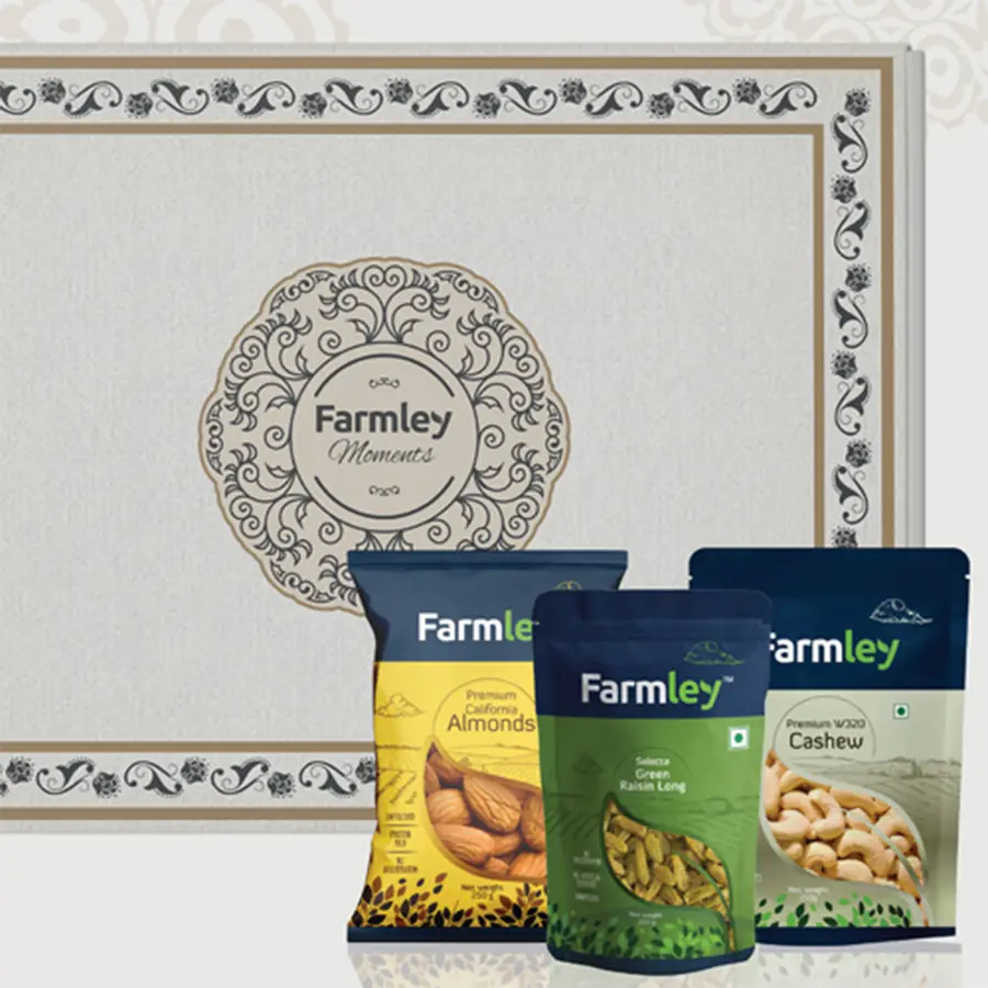 Blissful Dried Fruits Gift Pack featuring California almonds, cashews, and long green raisins in an elegant white-patterned box