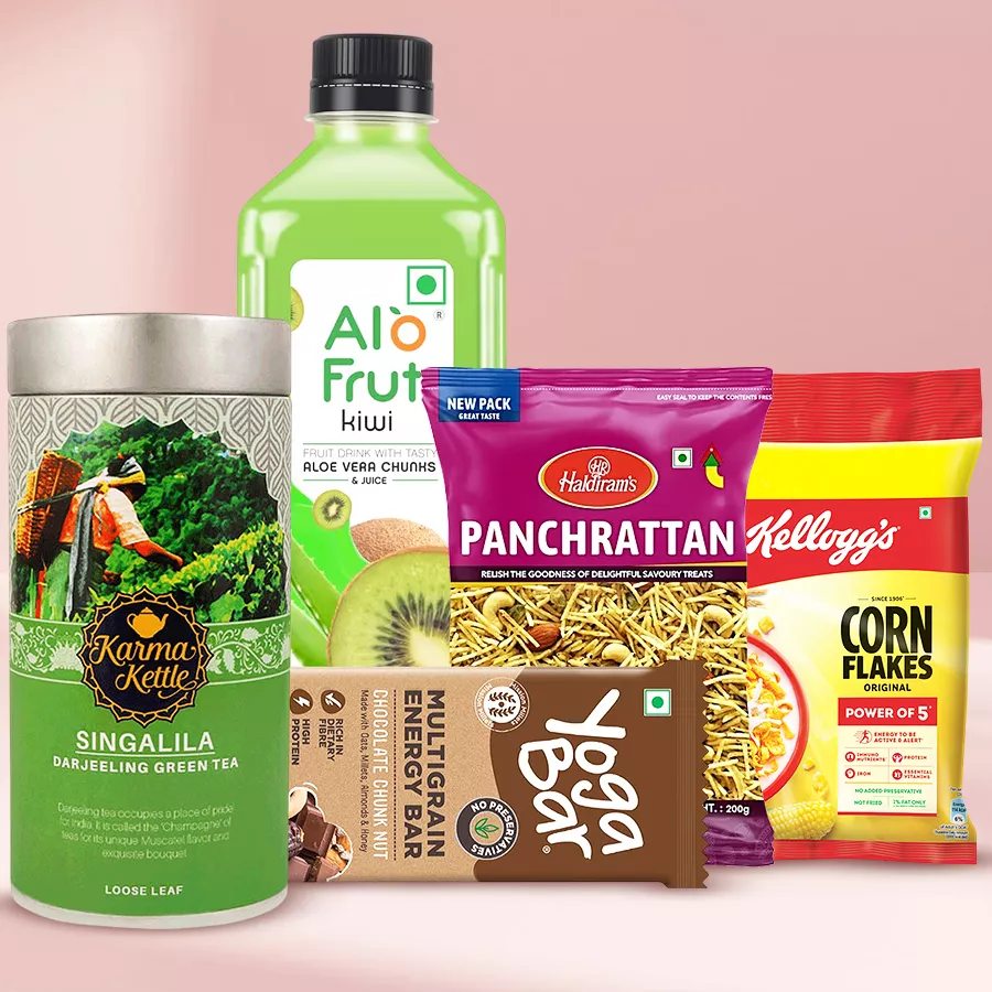 Healthy Breakfast Hamper with Singalila Tea, Aloe Vera Juice, Yoga Bar, Haldiram Panchratna, and Kellogg's Cornflakes arranged in a basket