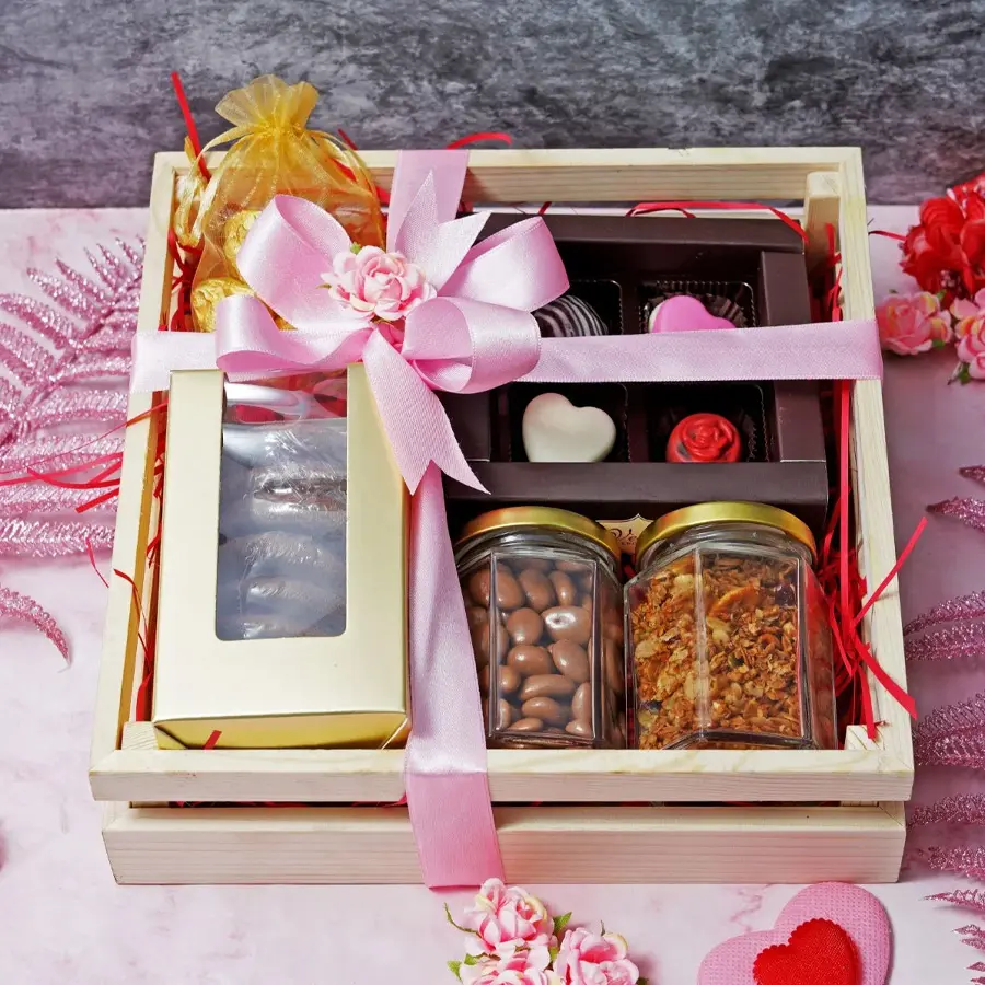 Delightful Crate Hamper for Mother's Day filled with chocolates, cookies, and treats arranged in a wooden tray.