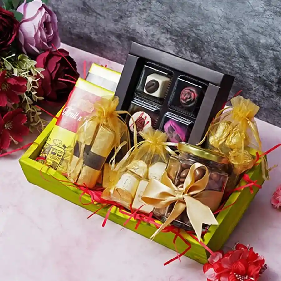 Artisanal Chocolate Bliss Tray featuring assorted chocolates including Rose, Coffee, Strawberry, and Cranberry, along with Fruit N Nut and Oreo bars, assorted logs, chewy chocolate-coated raisins, and crunchy chocolate almond rocks, presented beautifully for special occasions.