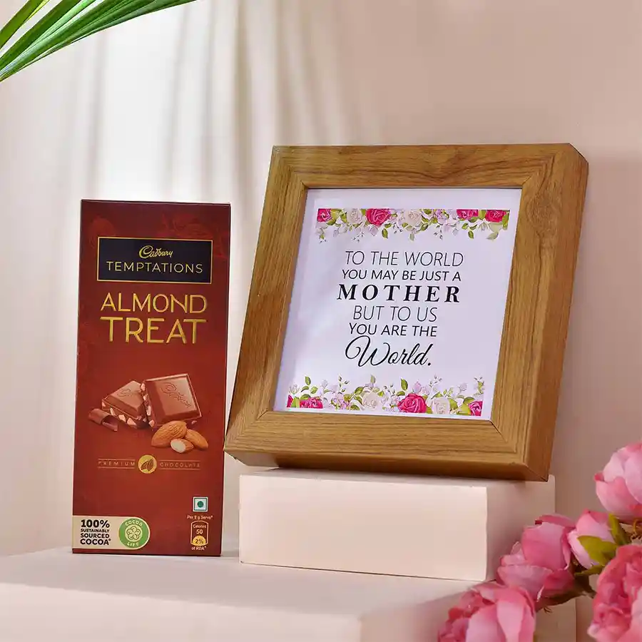 Sweet Mom Special Gift Combo featuring a "MOM - My World" photo frame and Cadbury Temptations Almond Treat chocolates in a decorative arrangement.