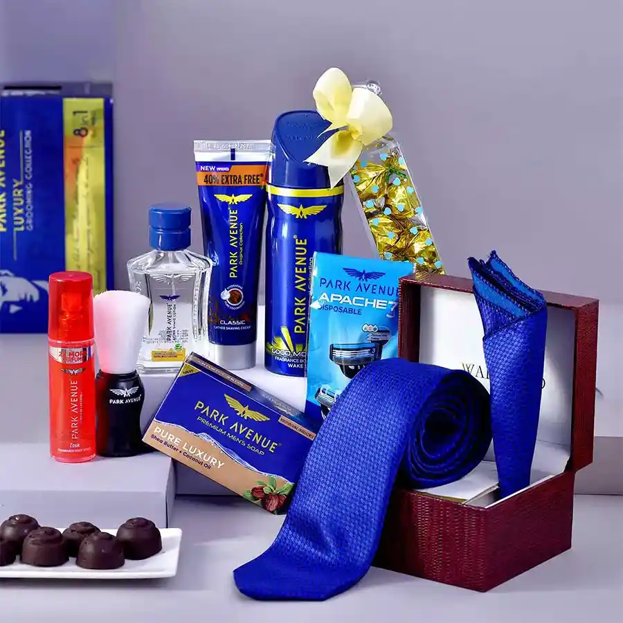 Saphire Groom Hamper for Dad featuring a tie and cufflinks set, handcrafted chocolates, and grooming products in a stylish arrangement.