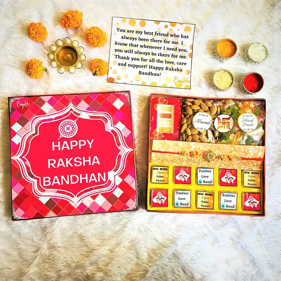 Rakhi combo set featuring a designer rakhi with colorful pearls, luxury chocolates, almonds, dried mixed fruits, and a Rakhi greeting card.