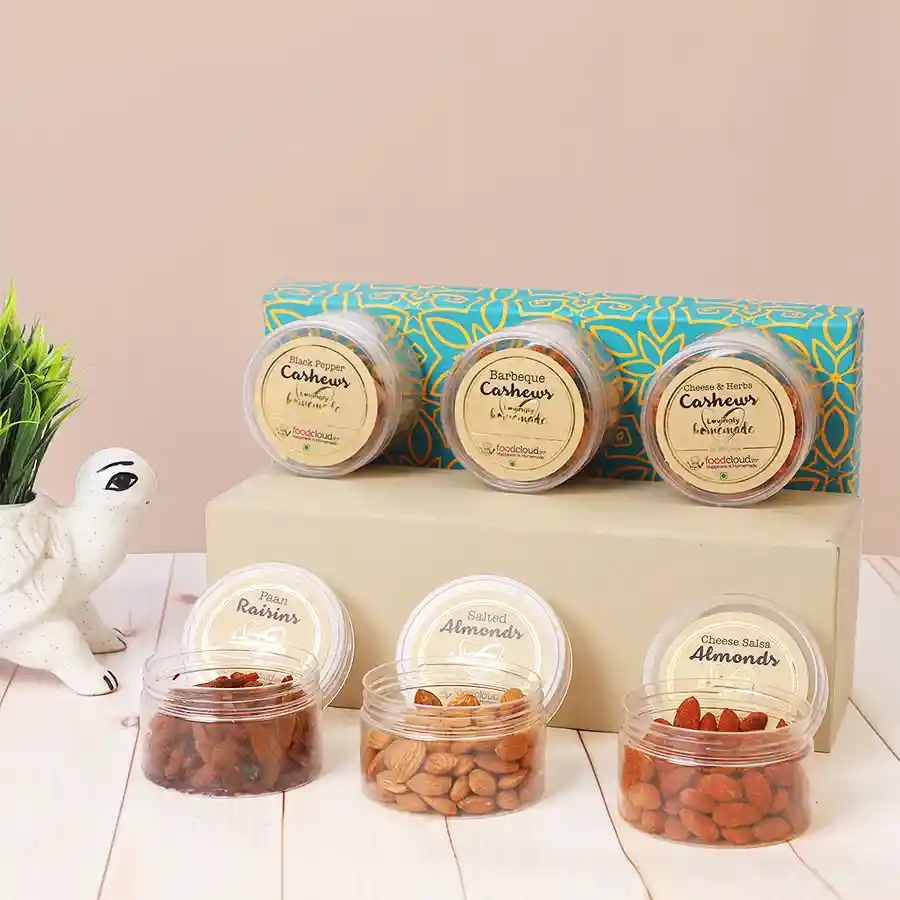 Tantalizing Flavoured Nuts Gift Box featuring spiced cashews, crunchy almonds, and sweet paan raisins in an elegant packaging
