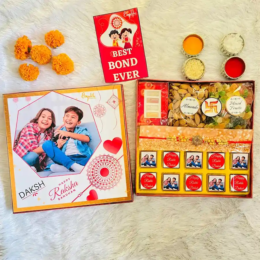 Customized Rakhi and Chocolates Gift Combo featuring a designer rakhi with colorful pearls, assorted chocolates, premium almonds, dried fruits, and a greeting card.