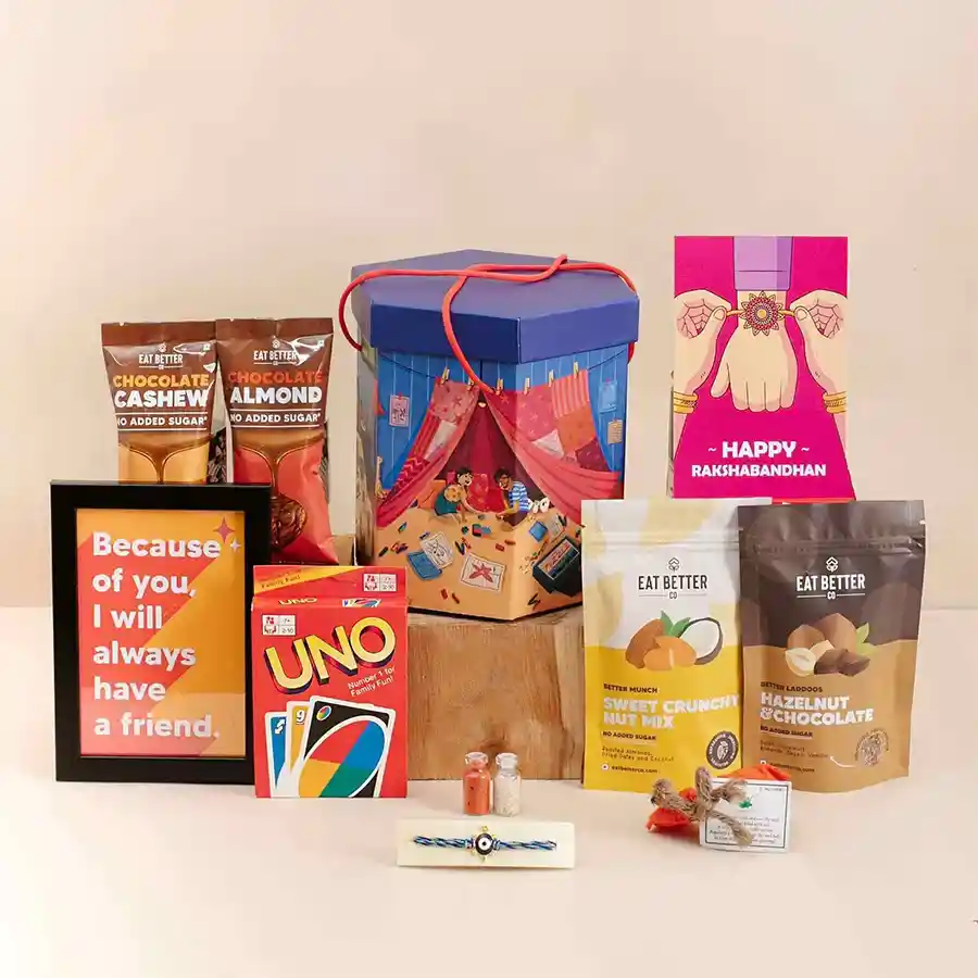 Throwback Rakhi Moments Hamper featuring Evil Eye Rakhi, Roli Tika, dry fruits, chocolates, personalized photo frame, and decorative box with message card.
