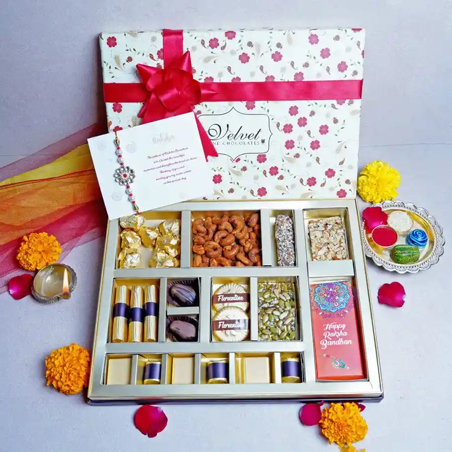 Loaded Rakhi Box with an assortment of sweets, designer Rakhi, and a greeting card