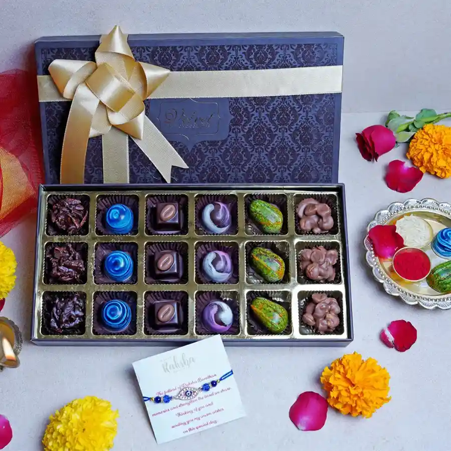 Luxury Sweet Box with chocolates, a designer Rakhi, and a greeting card, elegantly presented in a brown box for Raksha Bandhan celebrations.
