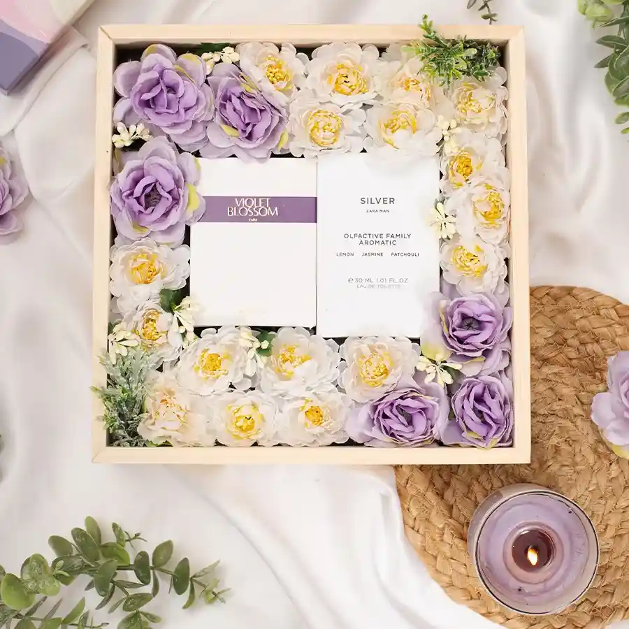 Love Delight Gift set with elegant perfumes, personalized acrylic pinewood box, and a beautiful flower arrangement