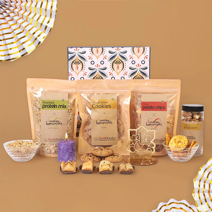 Love N Light Diwali Goodies Box featuring snacks, a scented candle, and a Lord Ganesh Rangoli stencil