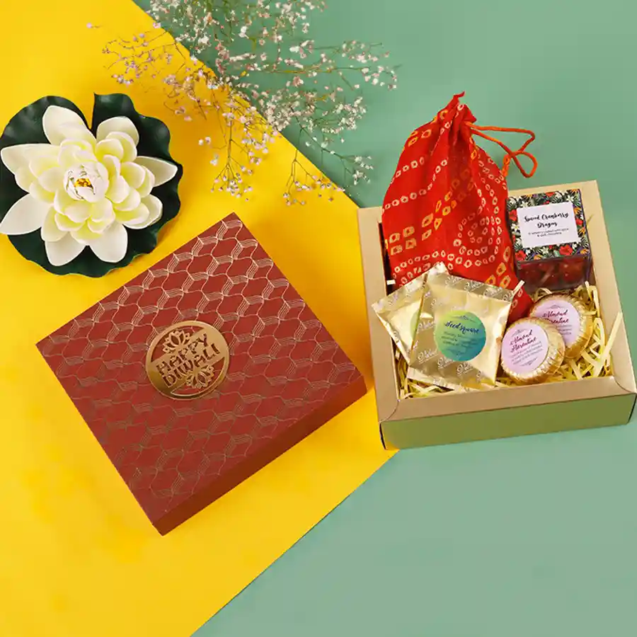 Assorted Chocolate Delight Collection in an elegant hamper with various handcrafted chocolates, including rich flavor squares, almond florentines, cranberry dragees, roasted almond, and butterscotch treats, beautifully packaged for Diwali celebrations.