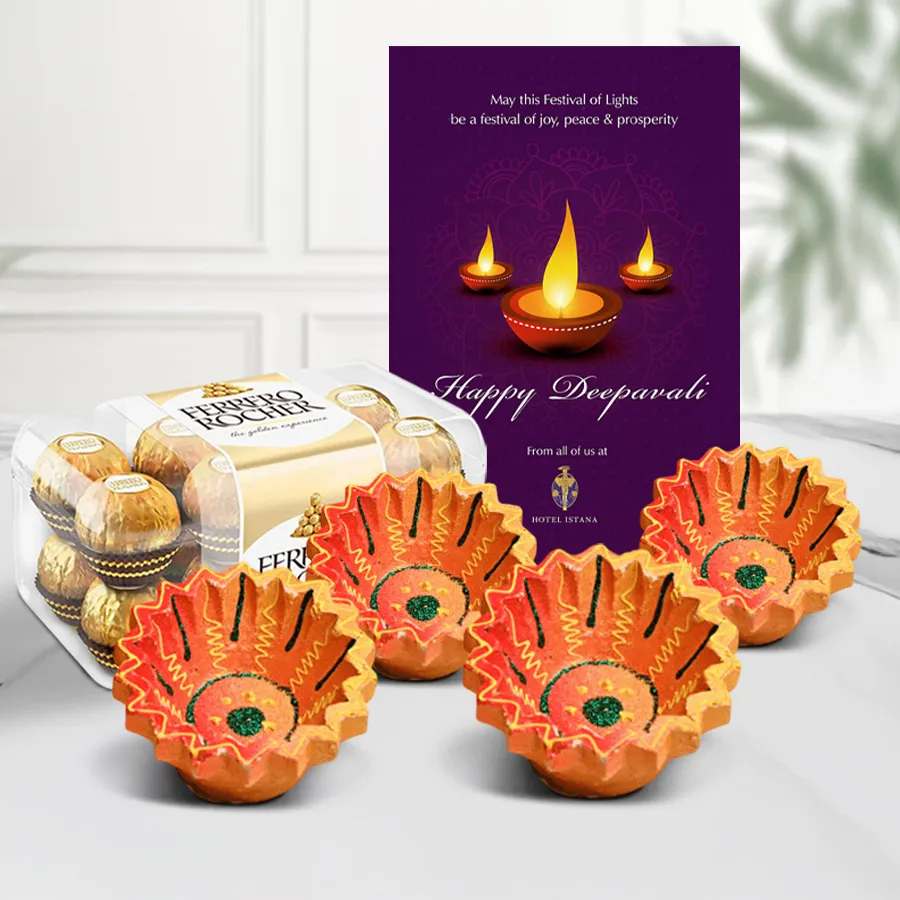 Diwali Diya and Chocolate Luster Hamper featuring Ferrero Rocher chocolates, handmade clay diyas, and a Happy Diwali greetings card
