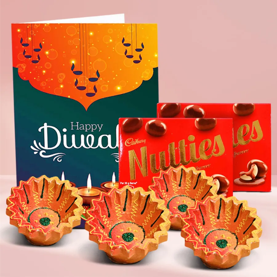 Diwali Diya Decadence and Chocolate Treats Box featuring Cadbury Nutties chocolates, decorative clay diyas, and a Happy Diwali card