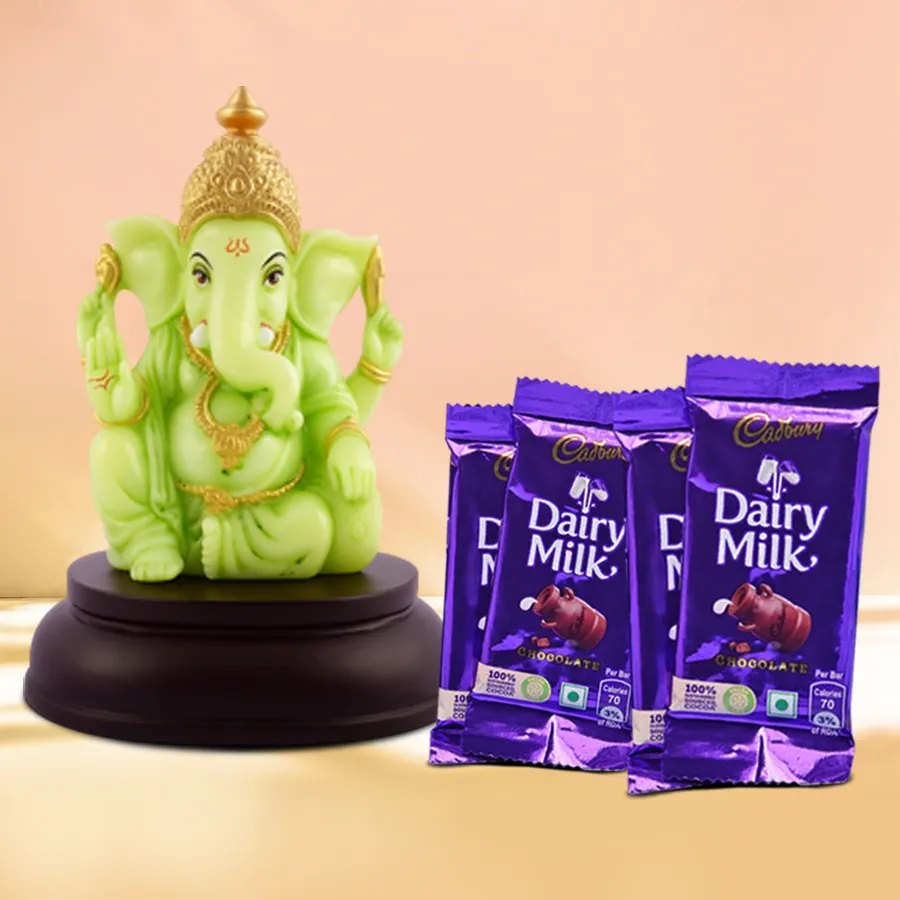 Divine Chocolate Gift Box featuring a glowing Ganesh idol and four Cadbury Dairy Milk chocolates, elegantly packaged for Diwali celebrations