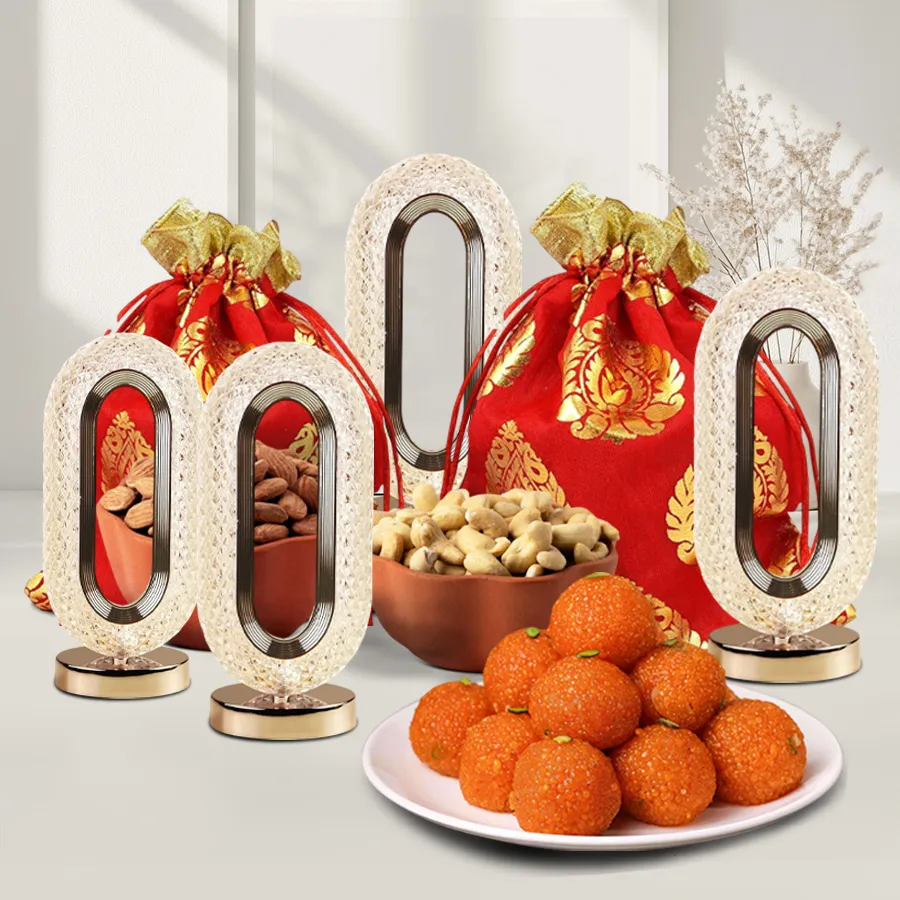 Diwali Chocolates n Crunches Bliss Box featuring crunchy cashews, tasty almonds, motichoor ladoos, and crystal LED lights in elegant potlis.